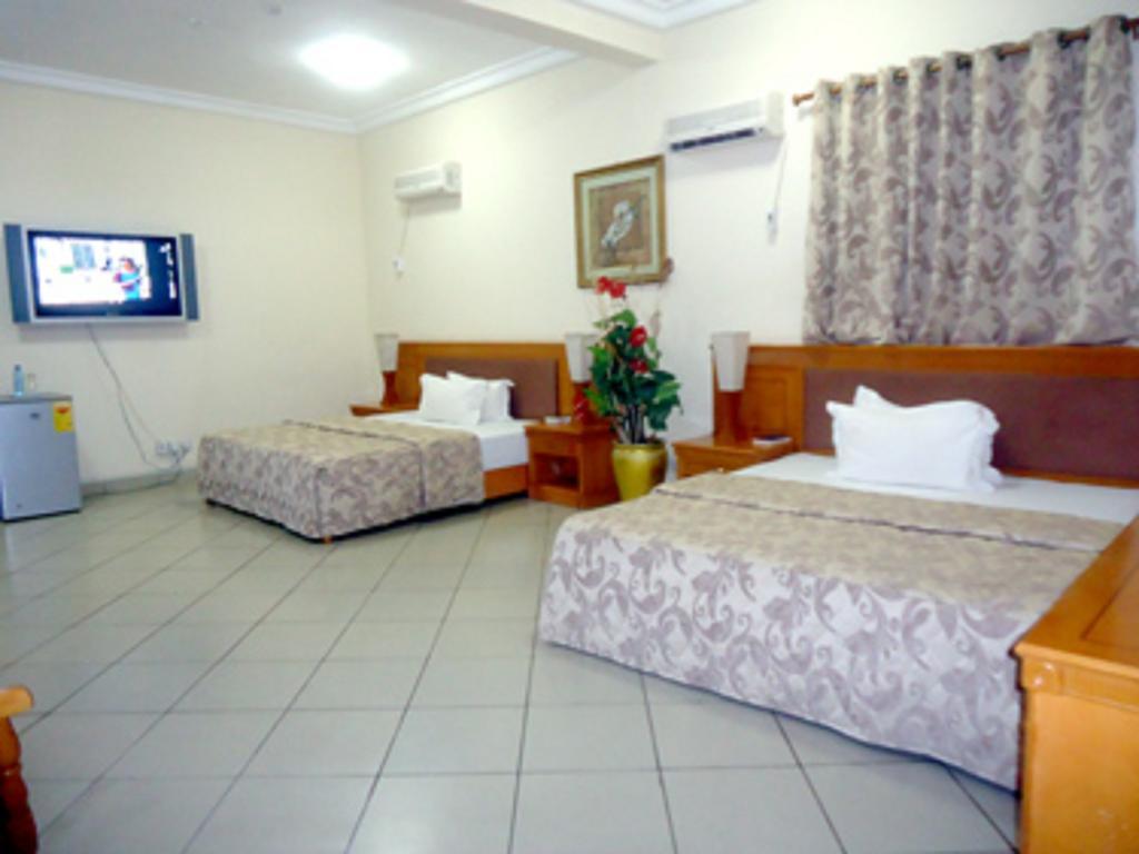 Sunset Hotel Kumasi Quarto foto